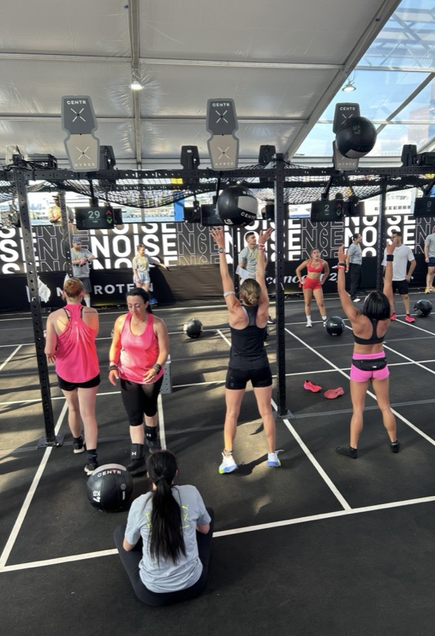 Athletes doing wall balls at a HYROX event